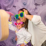 Top of the Shots Photo Booth White Pod with Flower Backdrop by Oxford Discos in Oxfordshire